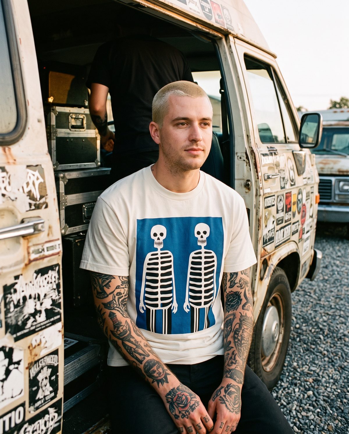 Bone Twins tee worn in the door of a tour van